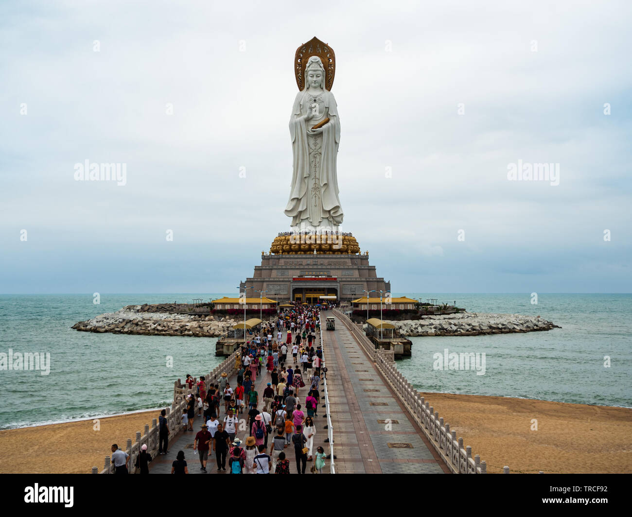 NANSHAN CULTURAL PARK, HAINAN, CHINA - Tourists and devotees at the statue of the Goddess of Mercy, Guanyin / Guan Yin / Kuan Yin / Kwan Yin. The stat Stock Photo