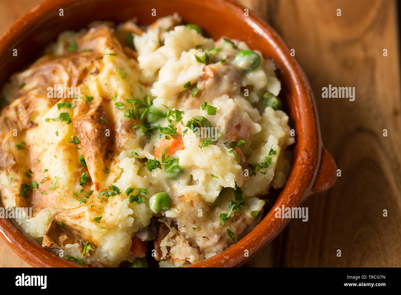 A homemade fish pie with ingredients including discounted kippers from a supermarket, a pollack fillet, cheap, frozen vegetables and discounted mashed Stock Photo