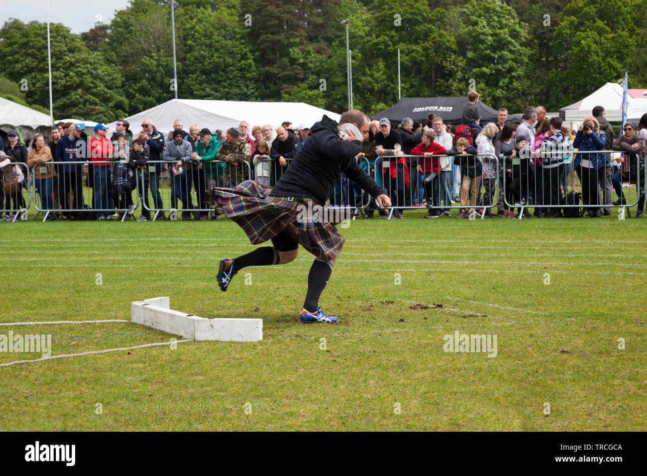 Man putting the shot at the Helensburgh and Lomond Highland Games, Argyll, Scotland Stock Photo
