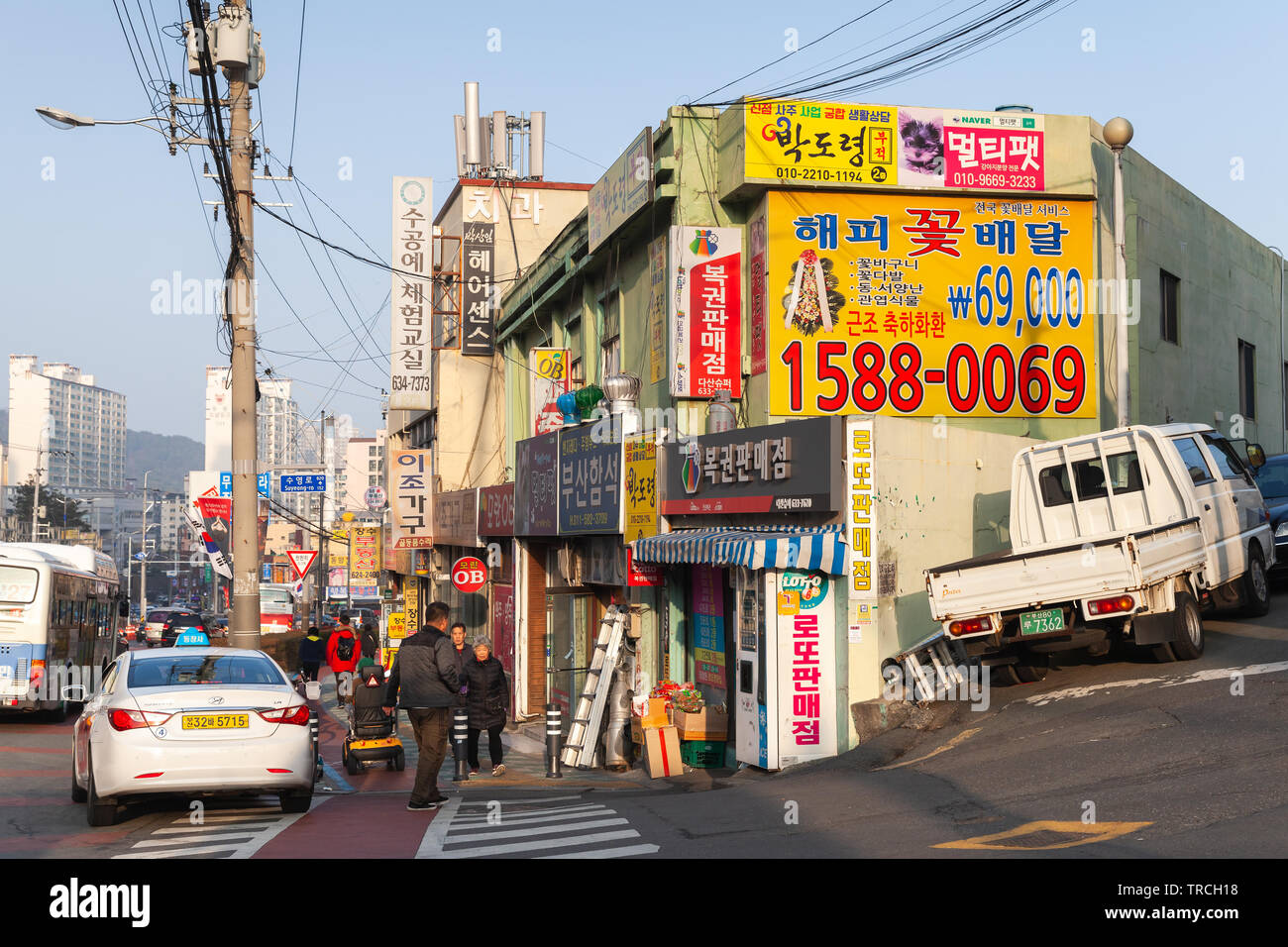 Busan, South Korea - March 12, 2018: Busan city, street view with markets, cars and walking people Stock Photo
