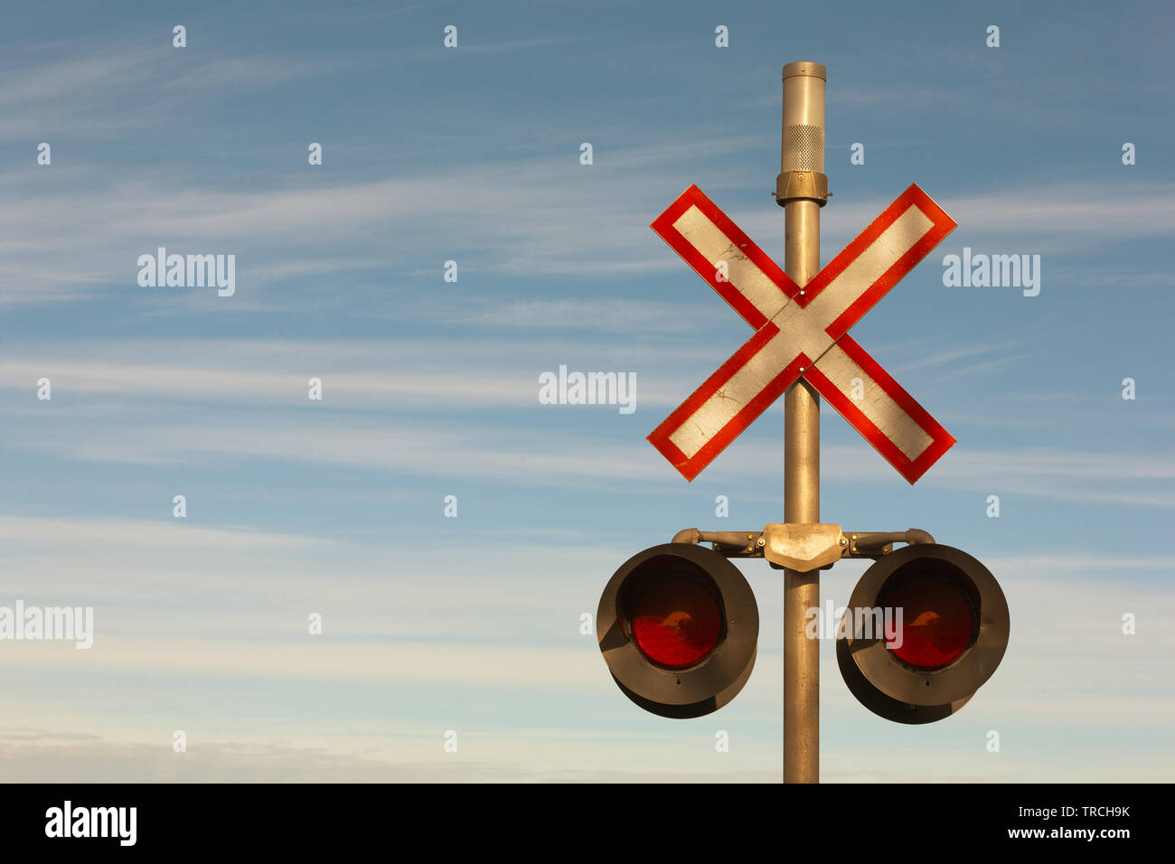 Railroad crossing signal lights and sign. Stock Photo