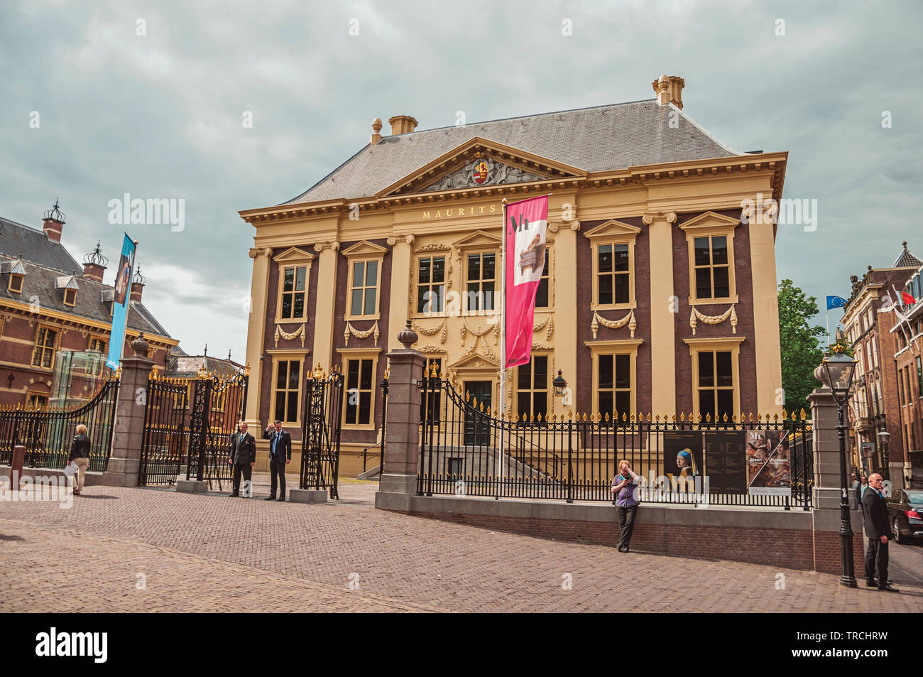 People and Mauritshuis House, museum with Dutch Golden Age paintings at The Hague. Is a mix of historic city with modernity in Netherlands. Stock Photo