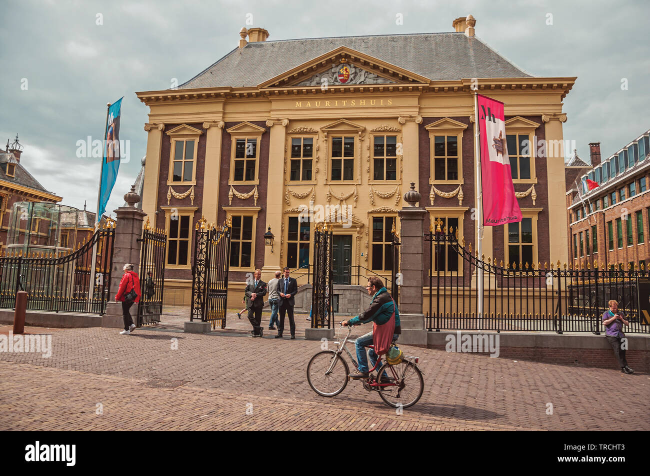 People and Mauritshuis House, museum with Dutch Golden Age paintings at The Hague. Is a mix of historic city with modernity in Netherlands. Stock Photo