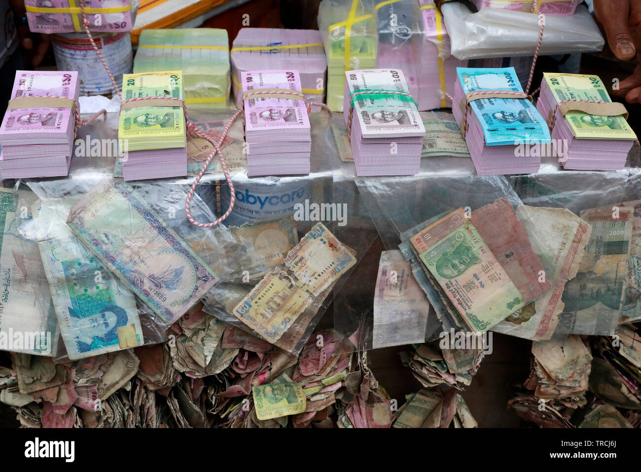 Dhaka, Bangladesh June 03, 2019 Vendors showcase crisp new notes for