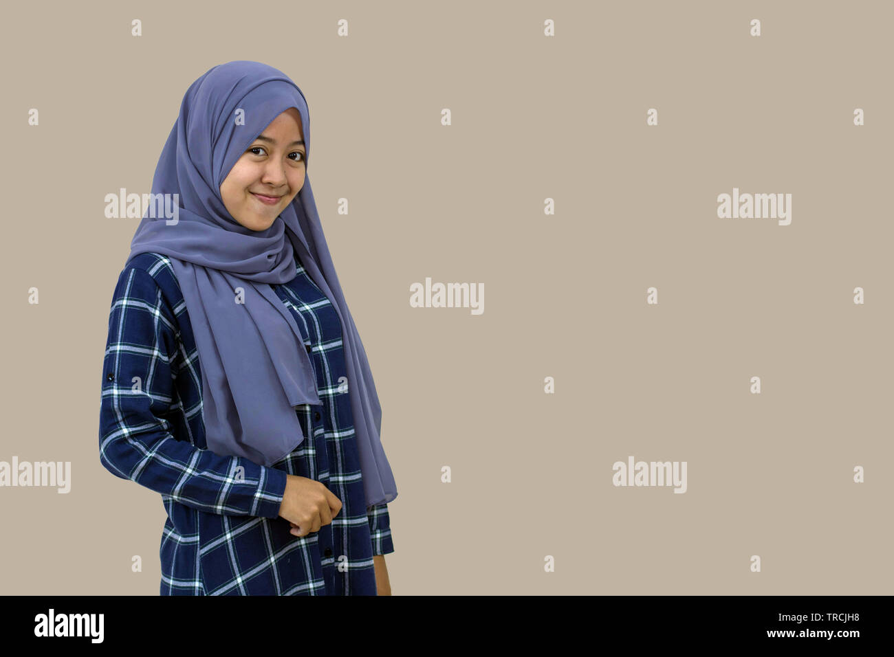 portrait of a beautiful Muslim hijab woman and smiling by posing in ...