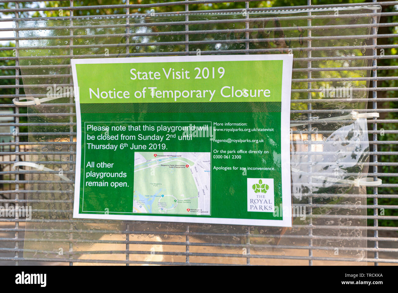 Warning notice on temporary fencing. Security around Winfield House, Regent's Park, London, UK for the State Visit of US President Donald Trump. Stock Photo