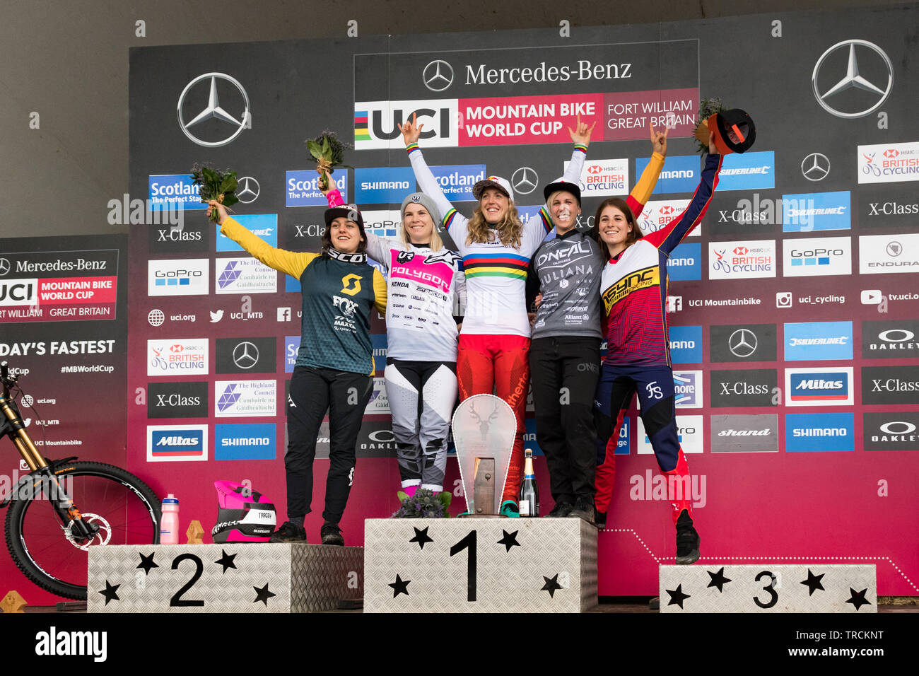 Fort William UCI Mountain Bike World Cup 2019 - elite women podium -Rachel Atherton celebrating her victory in the Women's Elite Final. From left to r Stock Photo