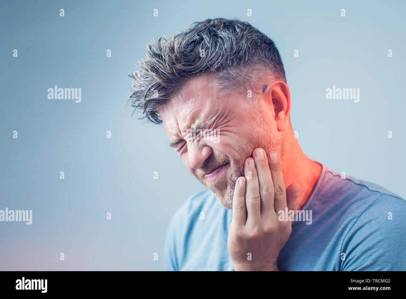 Toothache, medicine, health care concept, Teeth Problem, young man suffering from tooth pain, caries Stock Photo