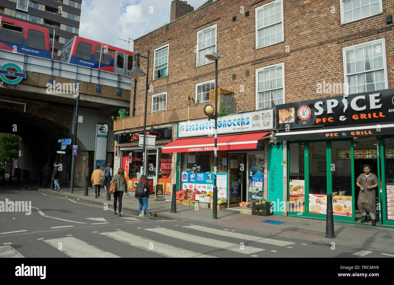 DLR train station by shops in Shadwell, east London,England,UK Stock Photo