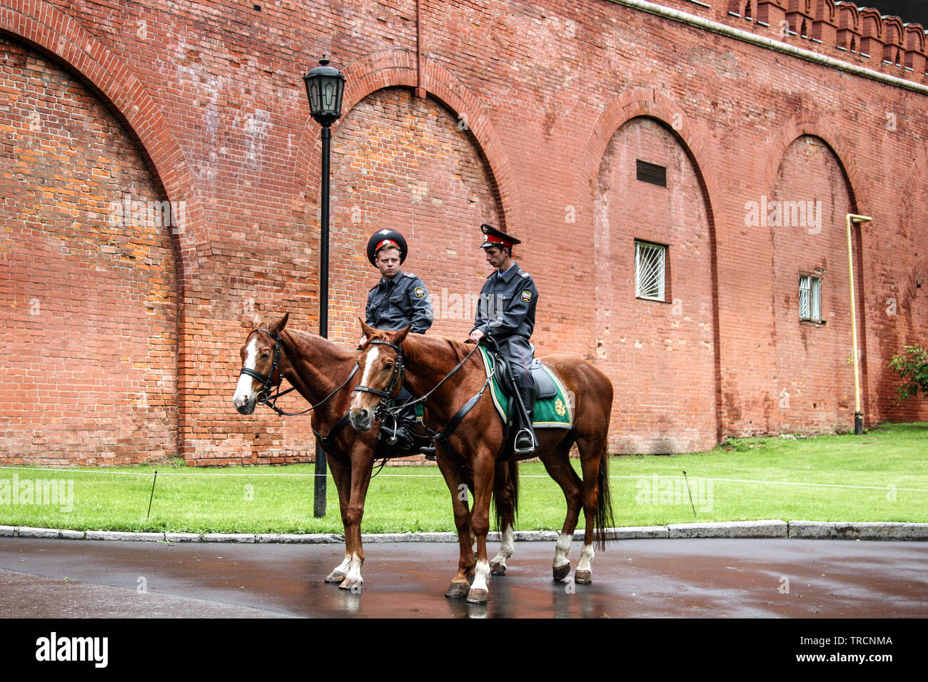 Two Moscow police officers on horseback at the Kremlin Wall, Moscow Russian Federation Stock Photo