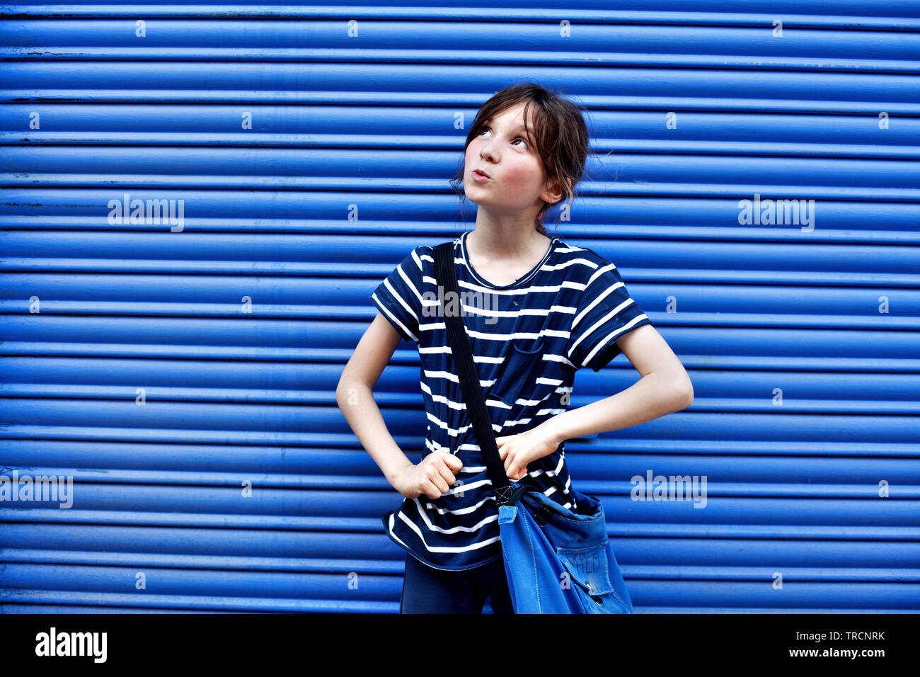 Ten year old boy in stripy blue shirt Stock Photo