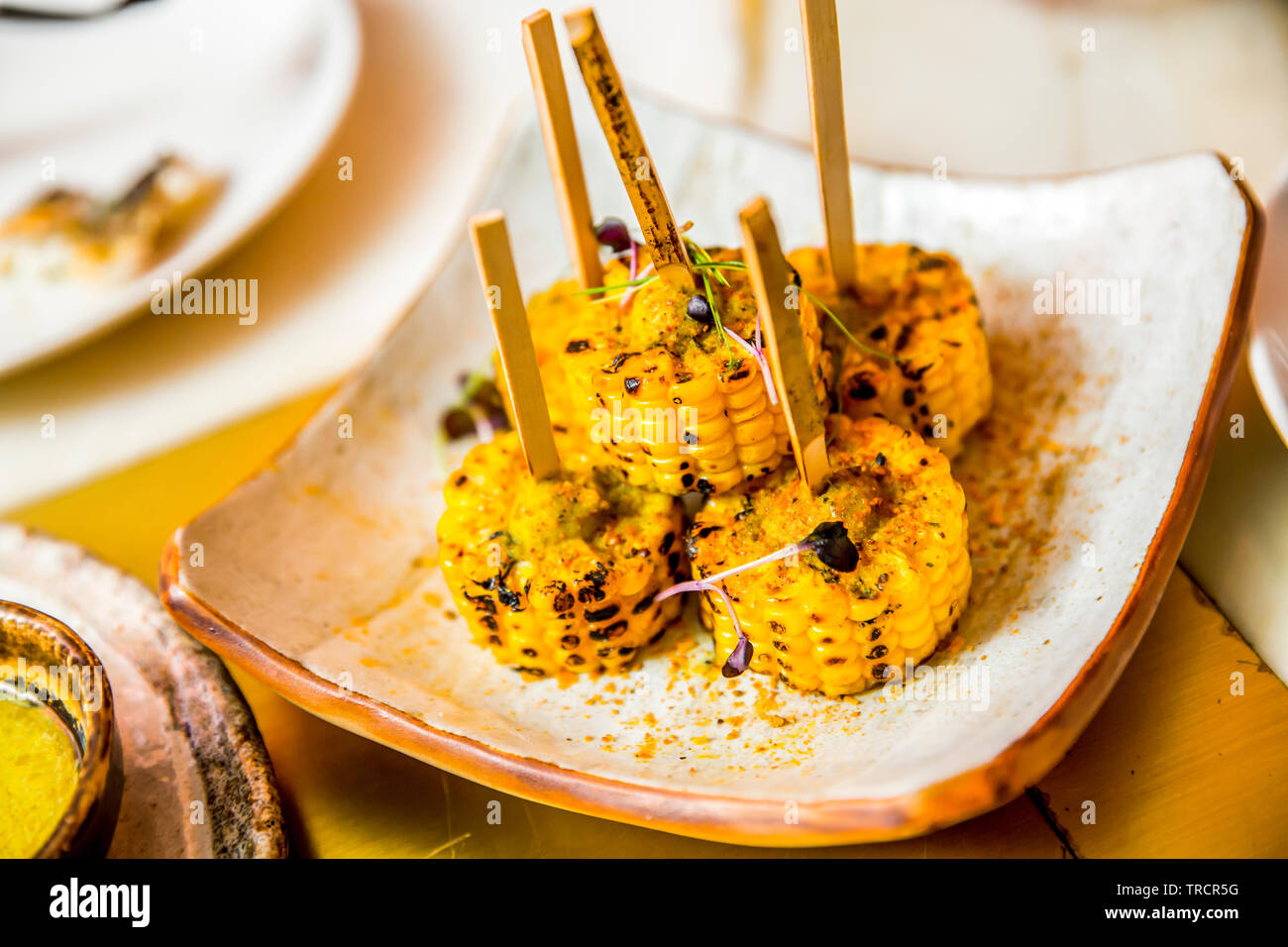 Grilled Corn Skewers in a plate Stock Photo