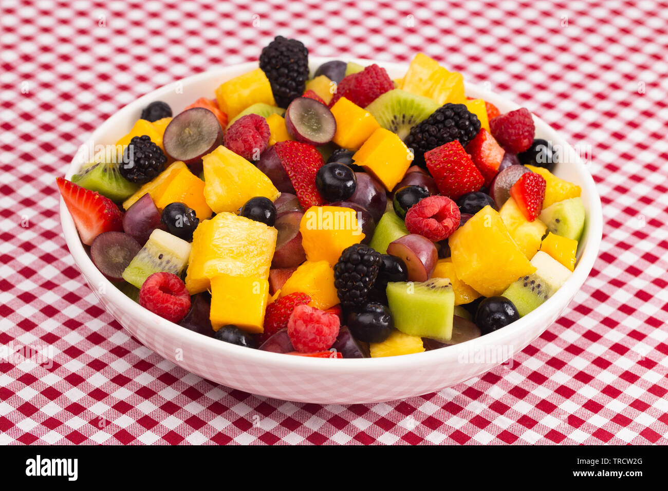 A Bowl Of Fresh Rainbow Fruit Salad On A Red Plaid Tablecloth Stock Photo Alamy