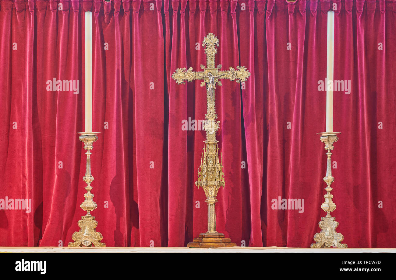 Cross and matching candles on a main altar at York minster cathedral