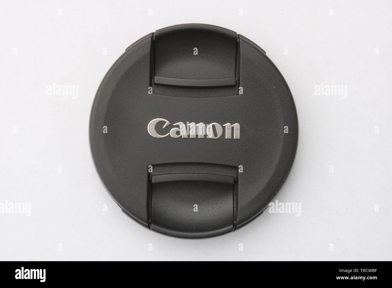Canon camera lens cap black isolated on white background Stock Photo