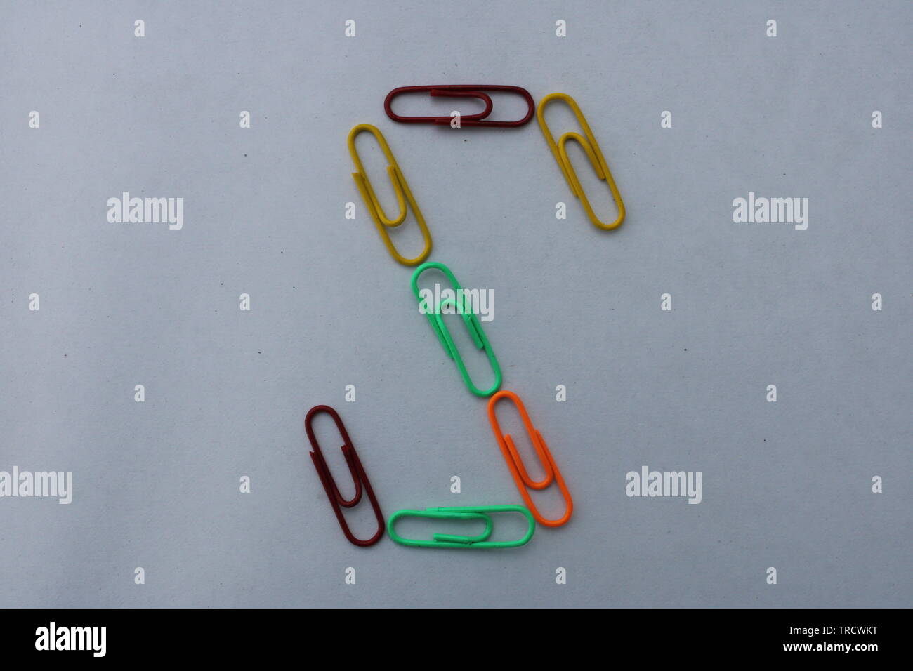 Letter S made with colorful paper clips on white background Stock Photo
