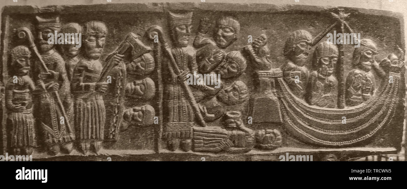 A Norman carving depicting St Nicholas  (known as St Nicholas of Myra and of Bari, and Nicholas the Wonderworker)  who was considered a patron saint of travellers, sailors and merchants (all depicted in the picture). In later years he also became the patron saint of archers, repentant thieves, children, brewers, pawnbrokers, and students Stock Photo