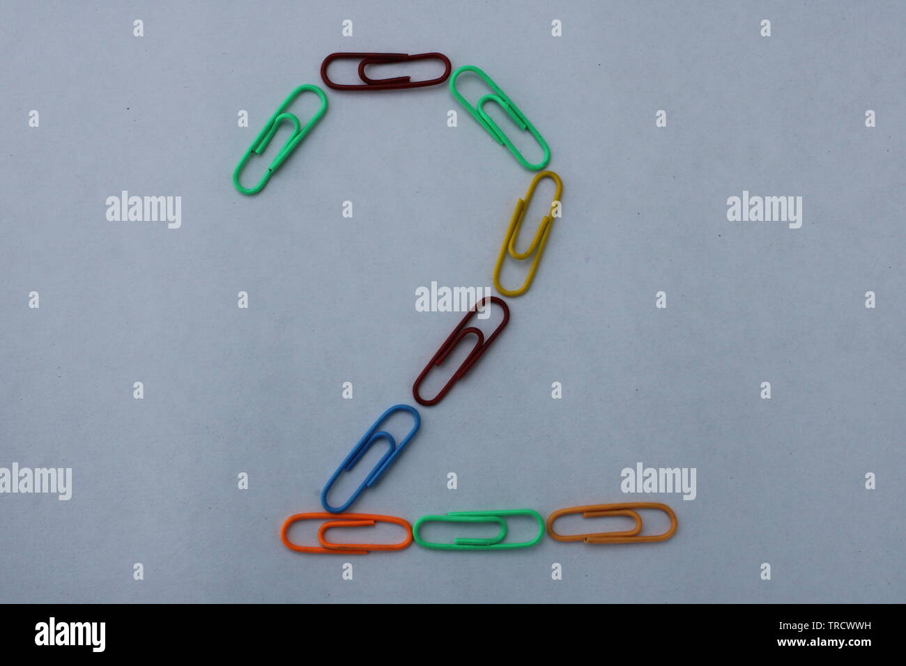 Number 2 made with colorful paper clips on white background Stock Photo