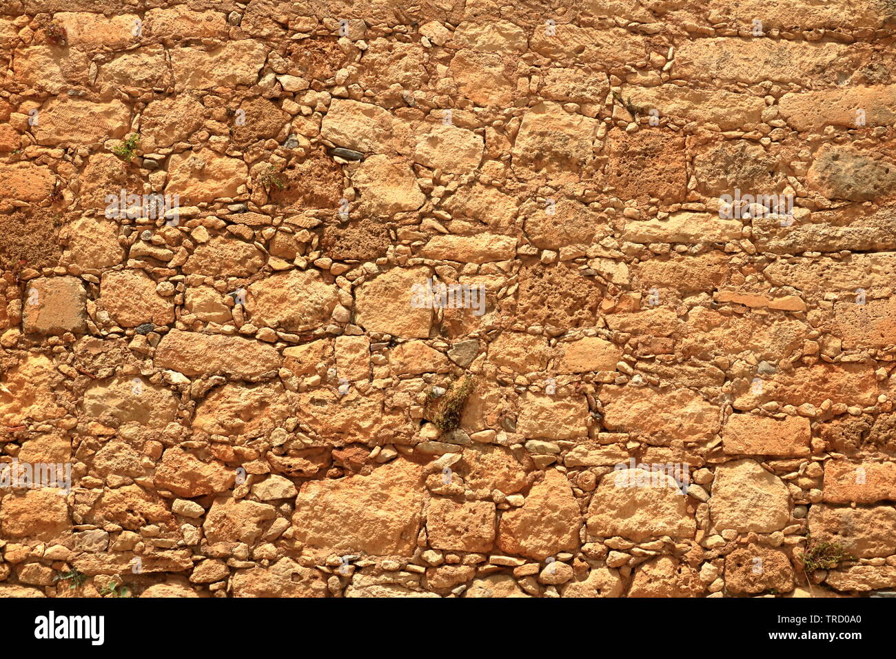 Big yellow wall made from stone bricks Stock Photo