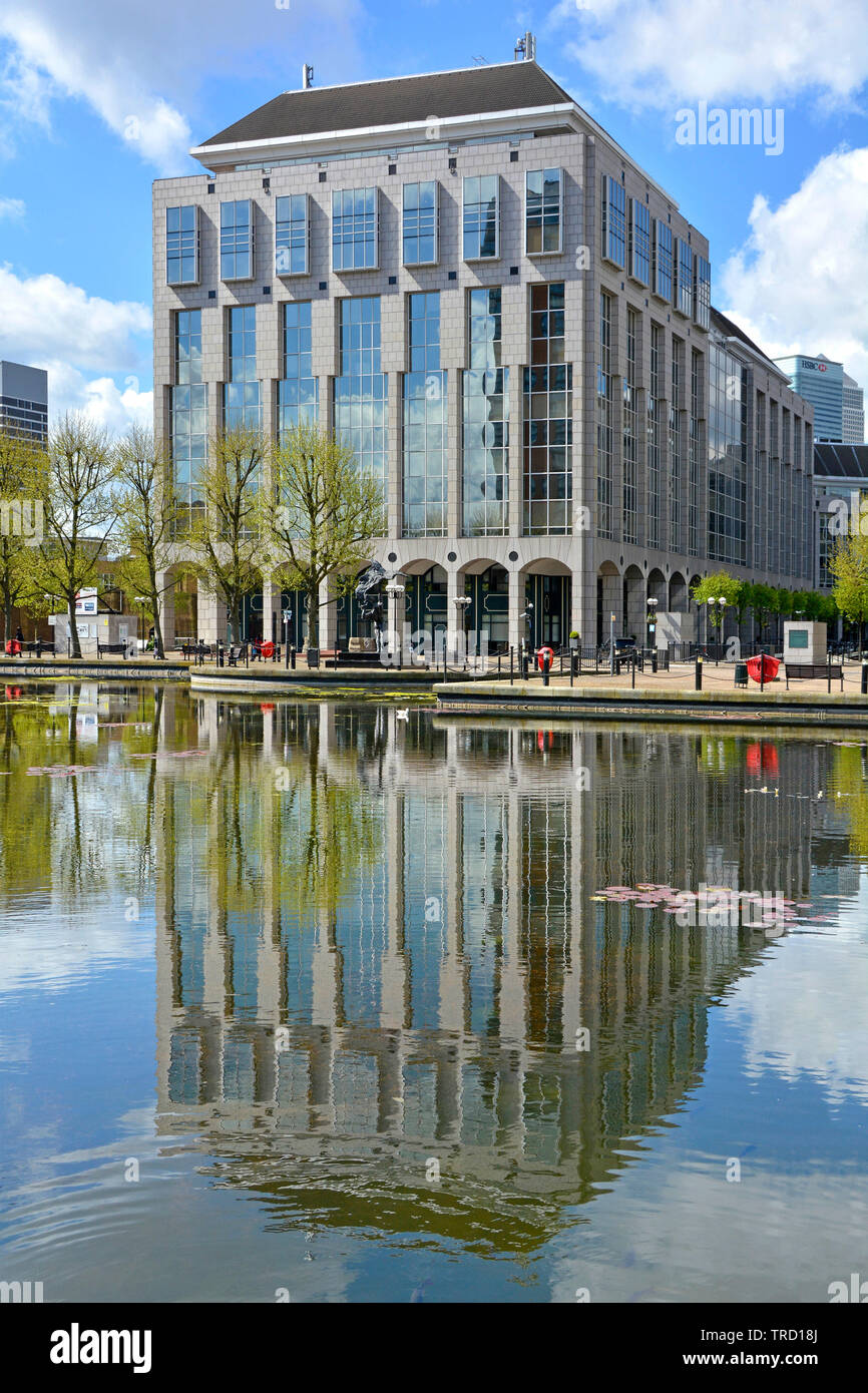 Office building complex includes Tower Hamlets Town Hall council offices in Mulberry House with reflection in landscaped water feature East London UK Stock Photo