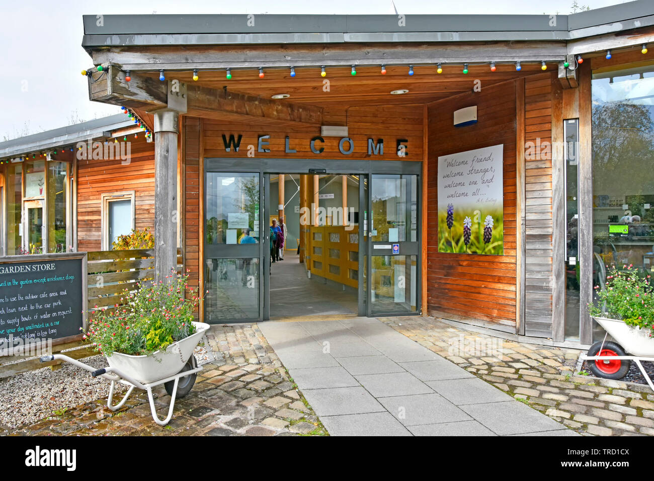 University of Liverpool Ness Botanic Gardens welcome sign over doors to gift & souvenir shop leading  to garden entrance Wirral Cheshire England UK Stock Photo