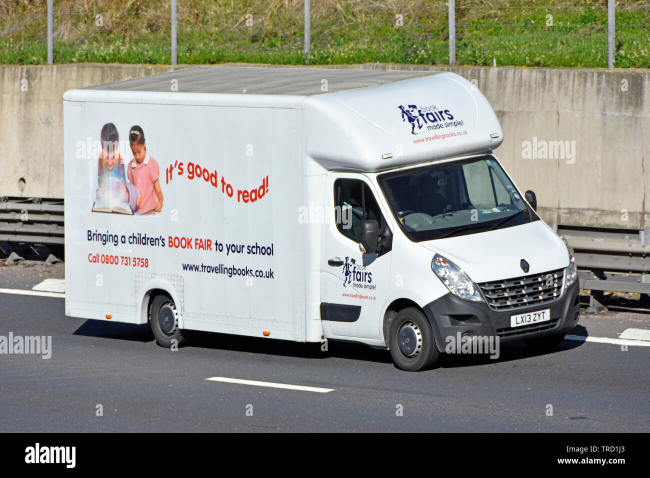 Renault van operated by Travelling Books business supplies for kids reading book fairs in education venue as pop up book shop at school on UK motorway Stock Photo