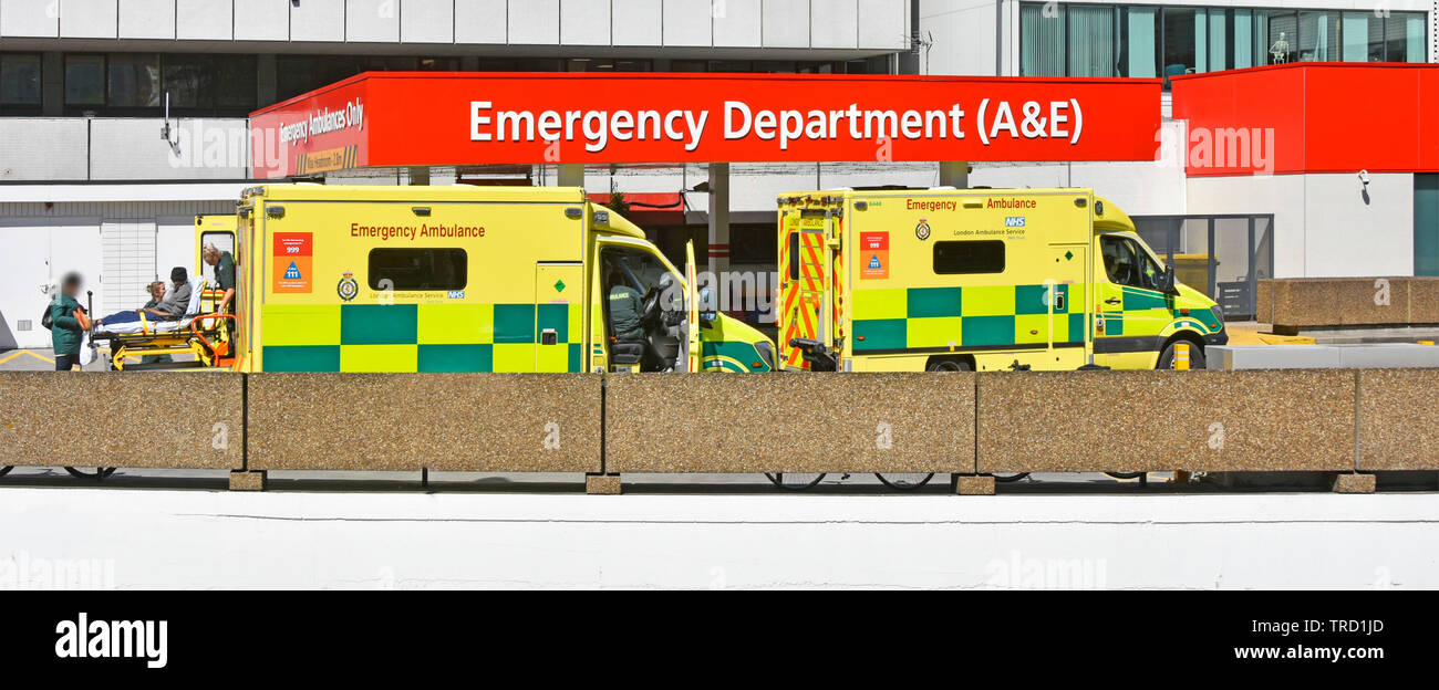London emergency ambulance paramedic care for stretcher patient delivery to A&E accident healthcare department building at NHS  hospital Lambeth UK Stock Photo