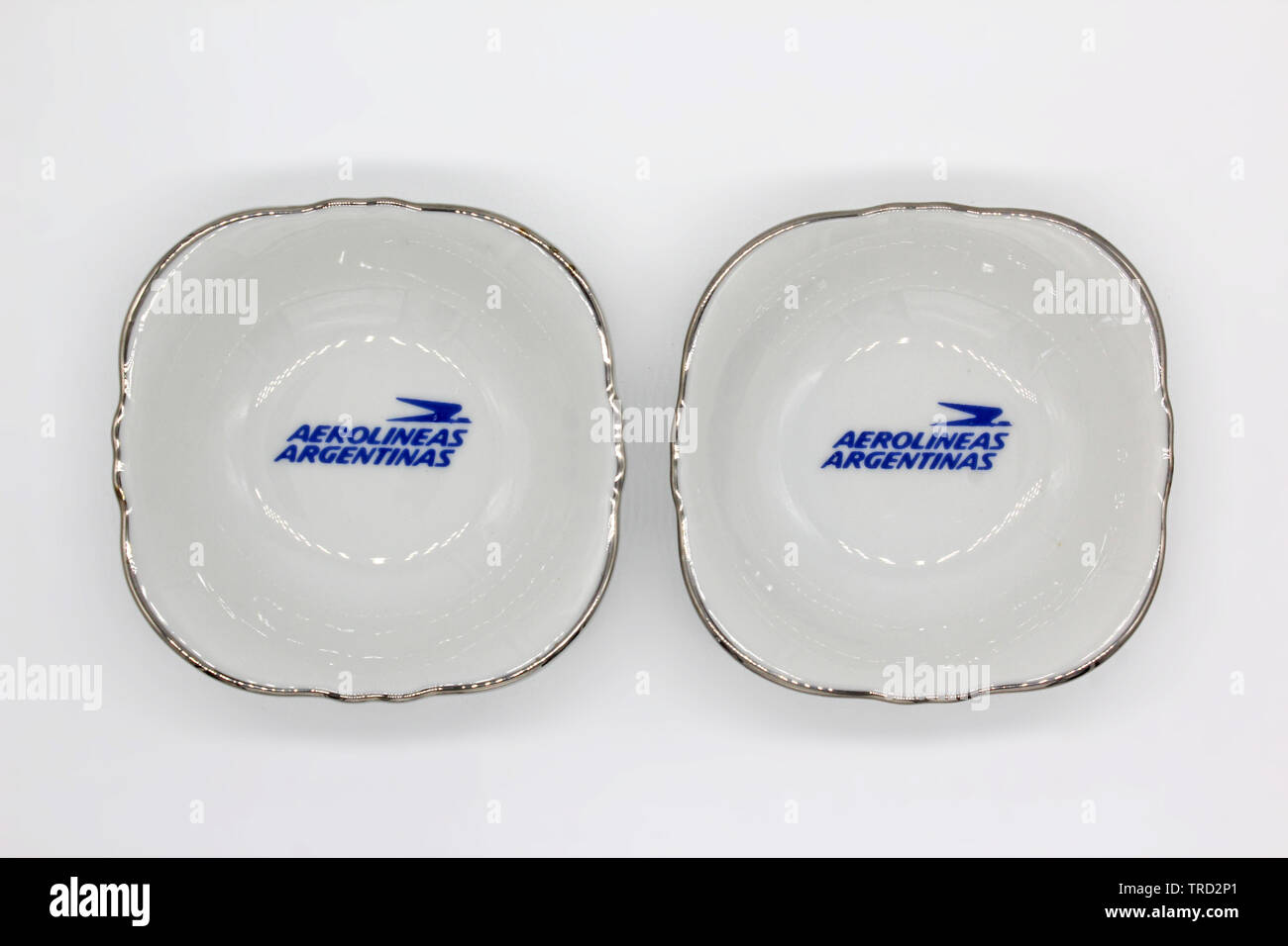 Aerolineas Argentinas porcelain plates with logo printed, isolated on a white background Stock Photo