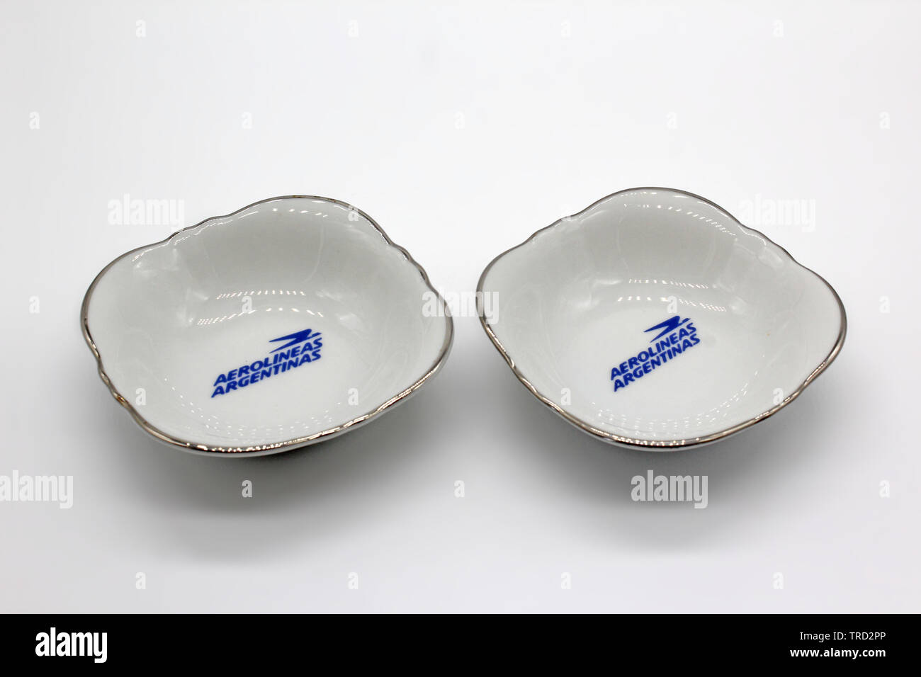 Aerolineas Argentinas porcelain plates with logo printed, isolated on a white background Stock Photo