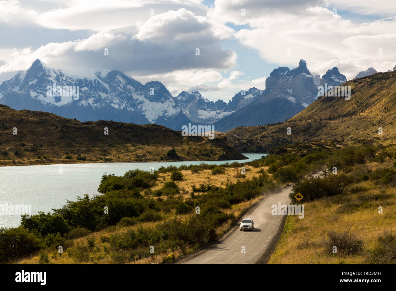 Single car driving on dirt road in Patagonia, Chile Stock Photo