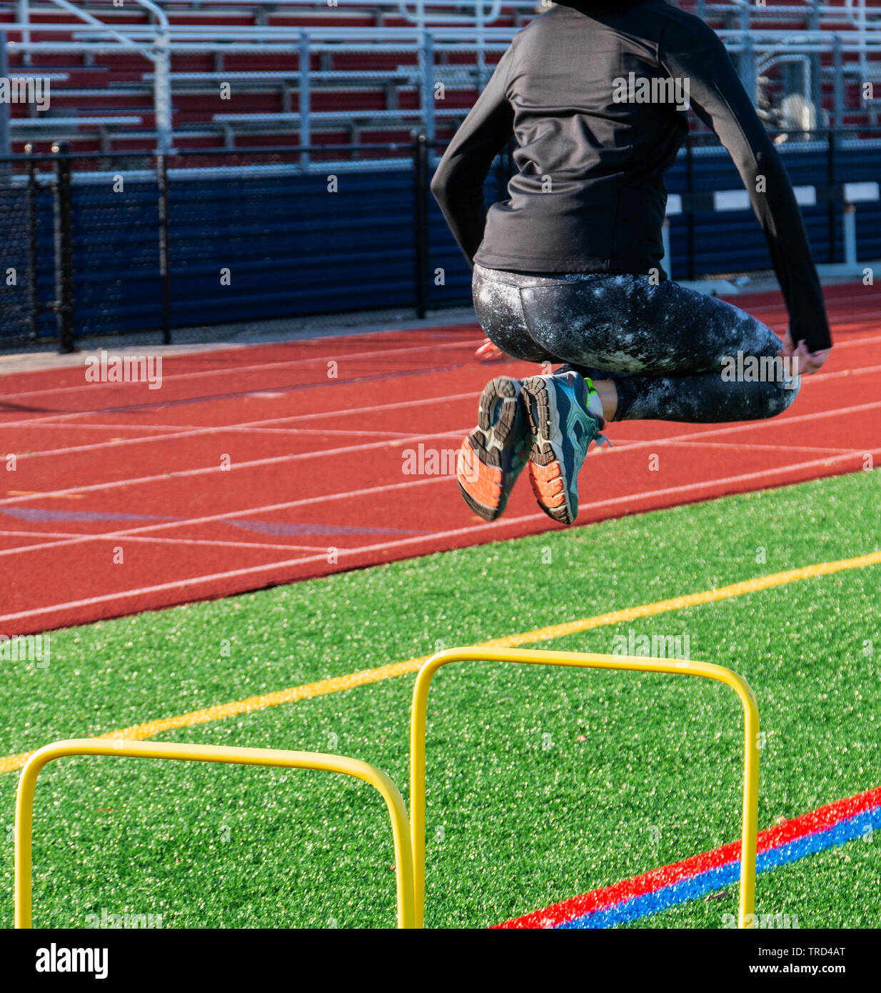Runner jumping a hurdle hires stock photography and images Alamy