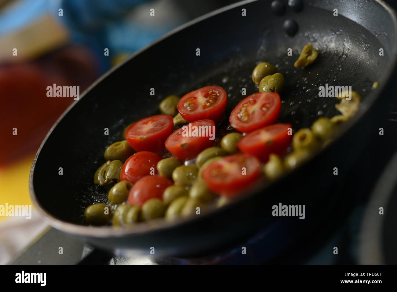 The chef bakes vegetables in a frying pan Stock Photo Alamy