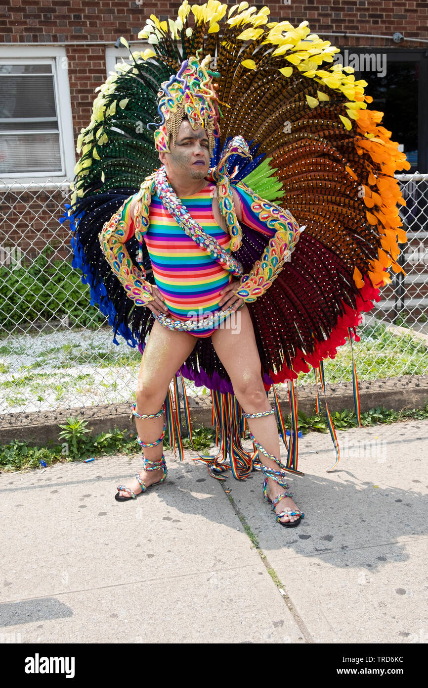 Posed portrait of a marcher in an elaborate peacock costume at the 2019 Queens Pride Parade in Jackson Heights, NYC. Stock Photo