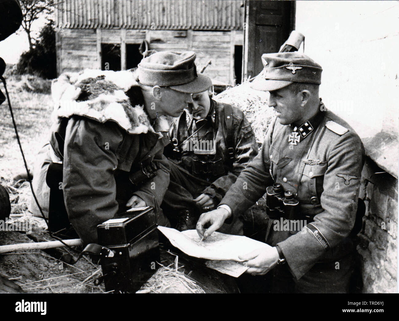 Waffen SS Officer Hans Dorr from the 5th SS Panzer Division Wiking issues orders to junior Officers 1944 9n he Russian Front Stock Photo