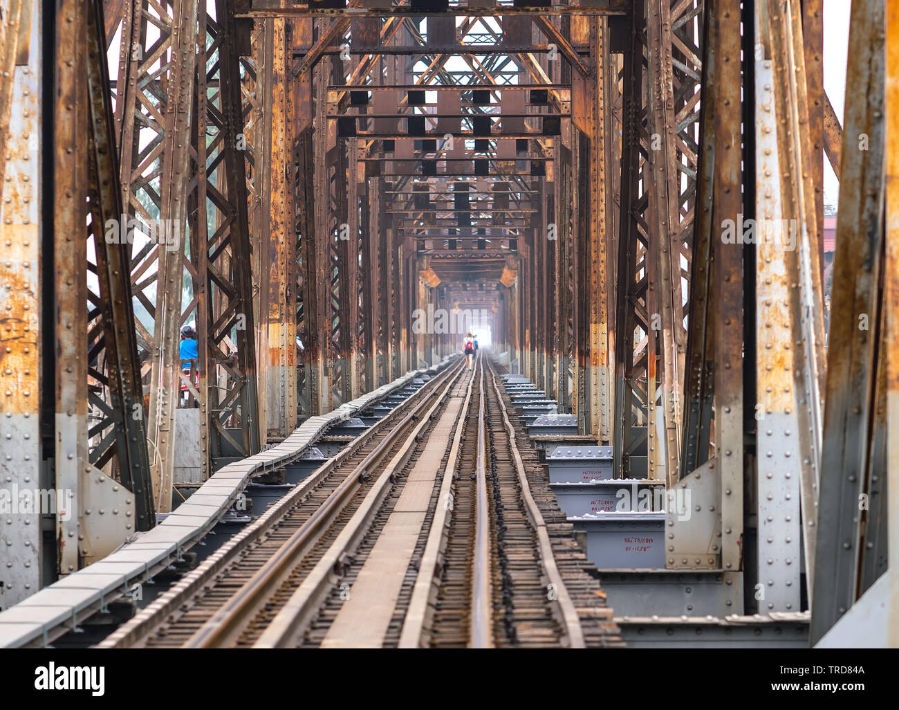 Vintage railroad tracks leading over the famous Long Bien Bridge, Hanoi
