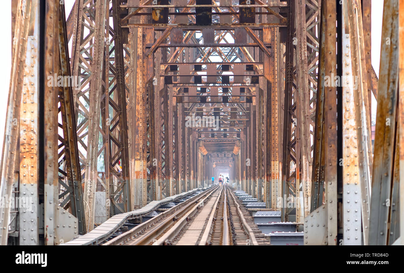 Vintage railroad tracks leading over the famous Long Bien Bridge, Hanoi