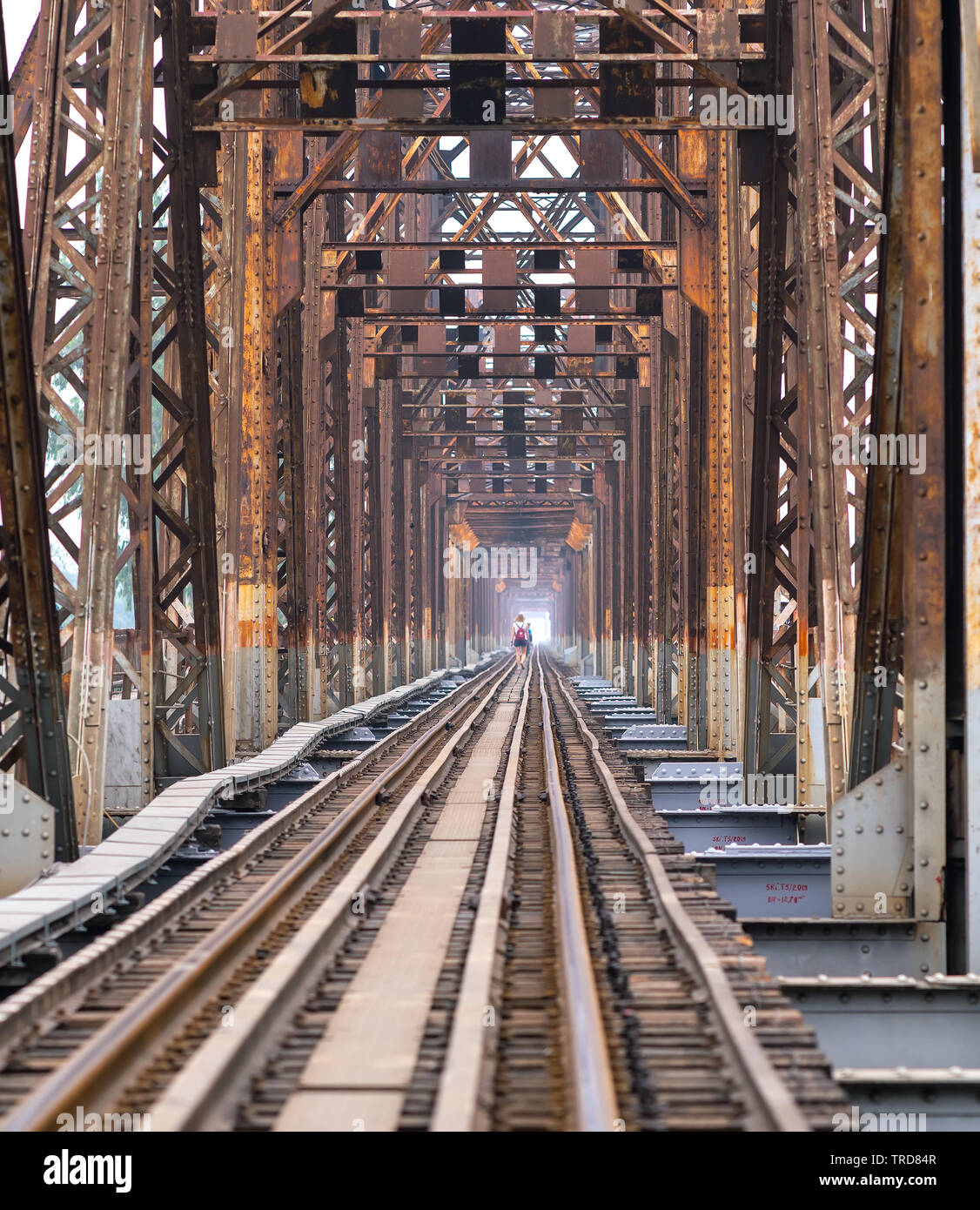 Vintage railroad tracks leading over the famous Long Bien Bridge, Hanoi