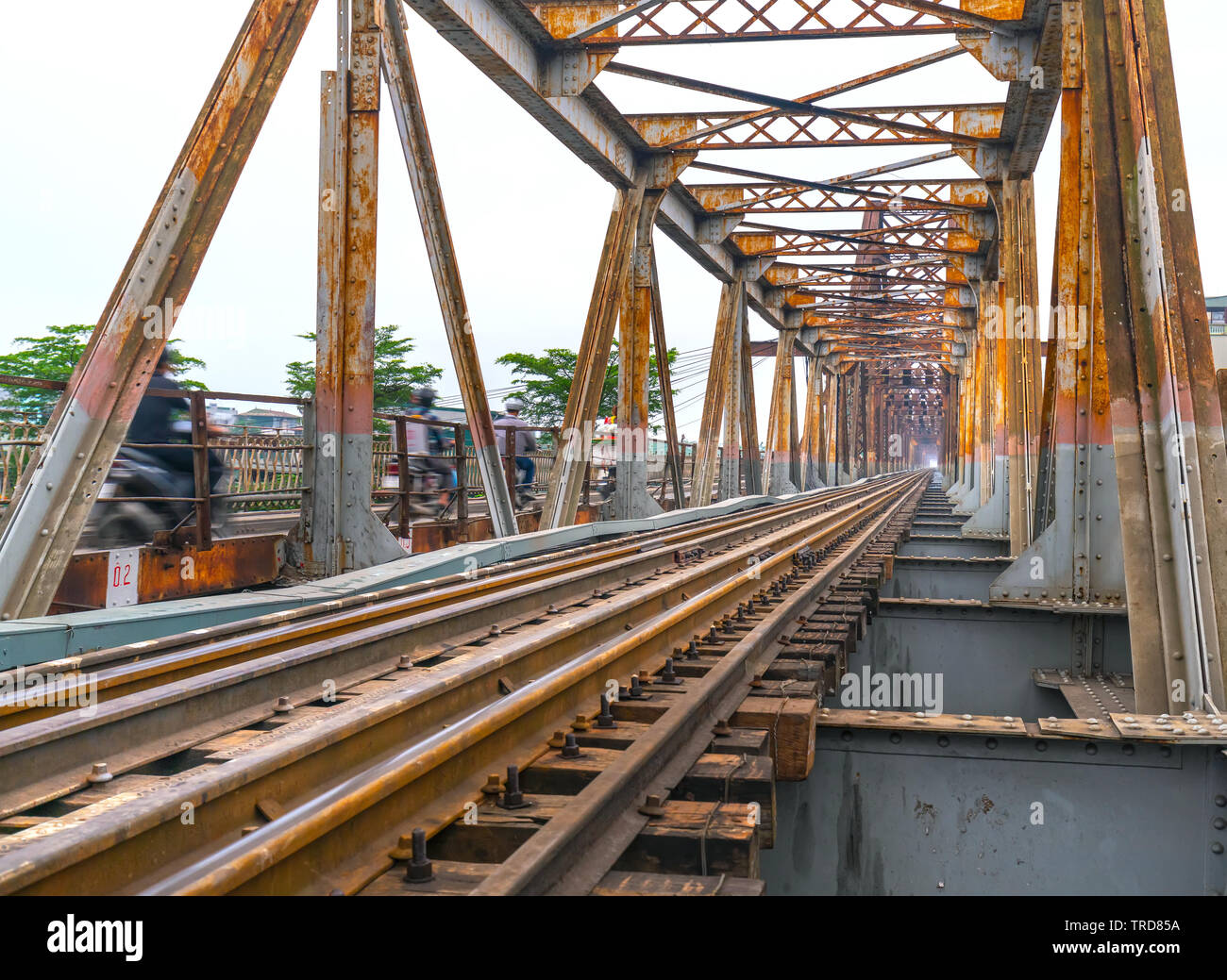 Vintage railroad tracks leading over the famous Long Bien Bridge, Hanoi