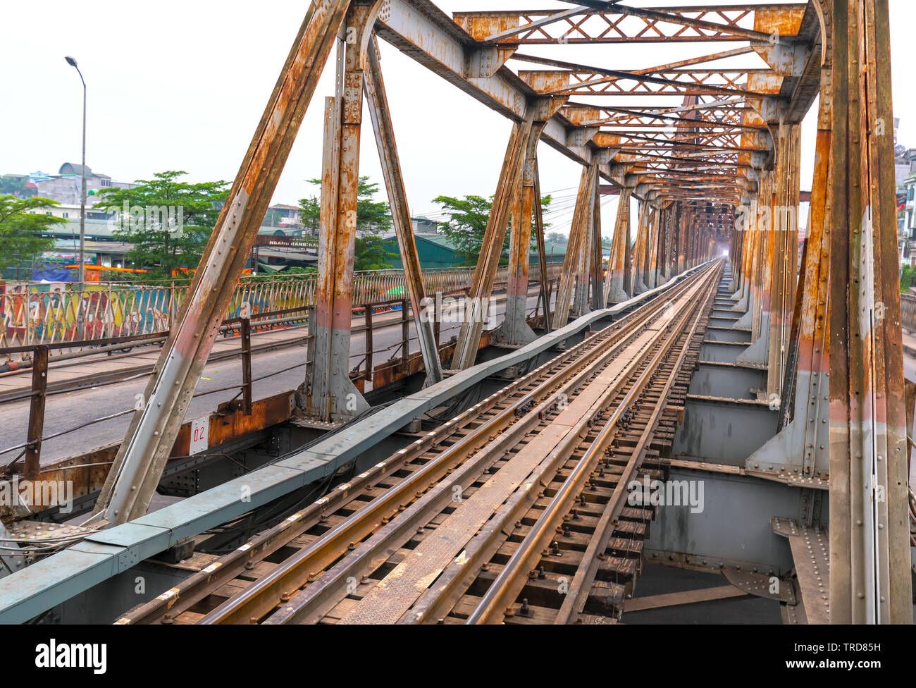 Vintage railroad tracks leading over the famous Long Bien Bridge, Hanoi