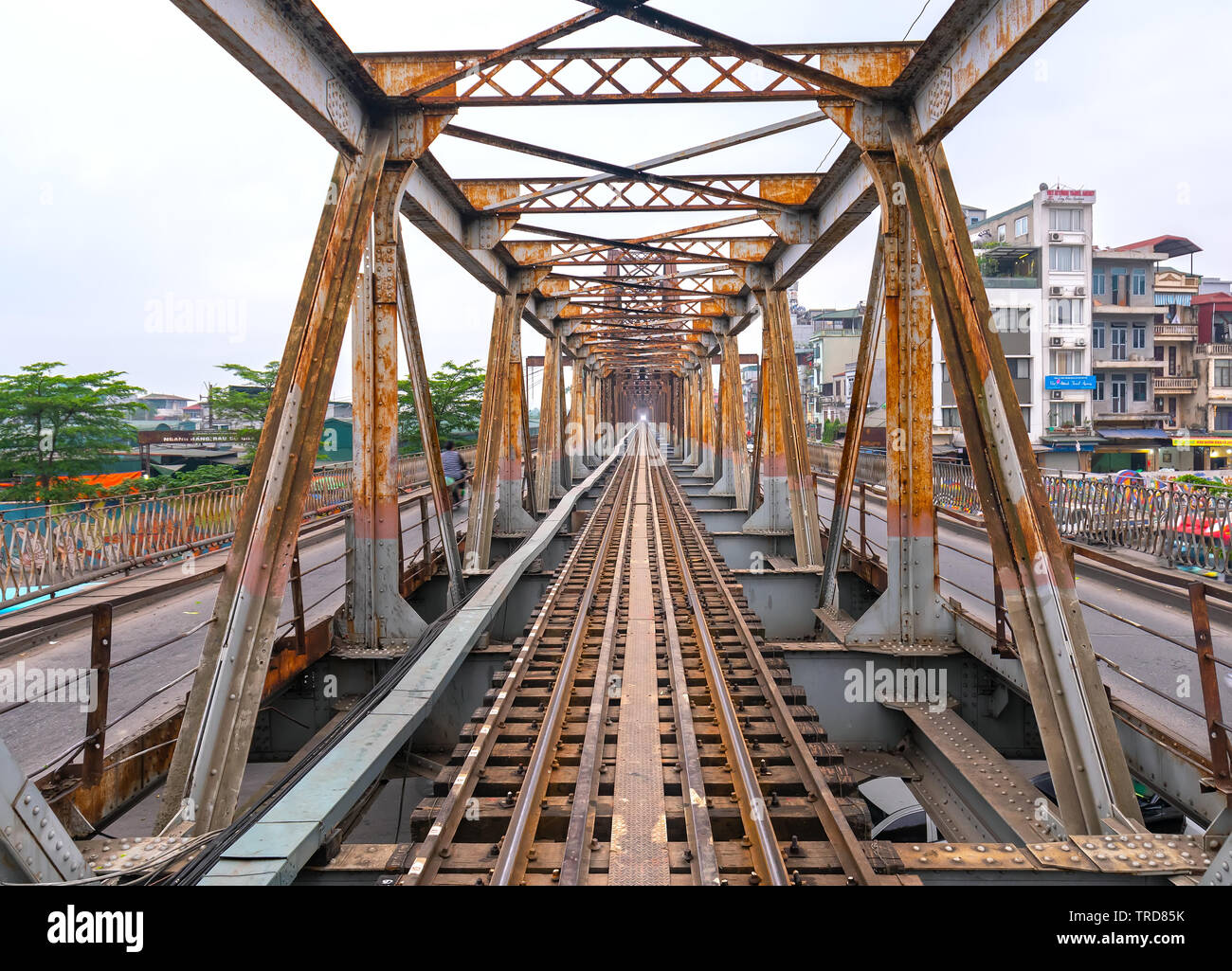 Vintage railroad tracks leading over the famous Long Bien Bridge, Hanoi