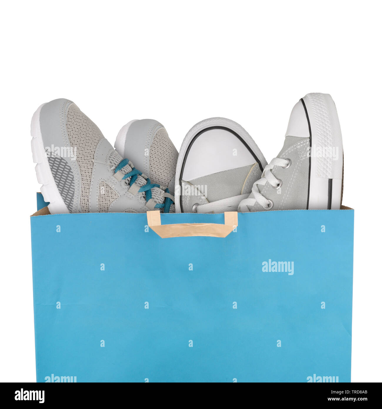 Shopping bag with sport shoes isolated on white background Stock Photo