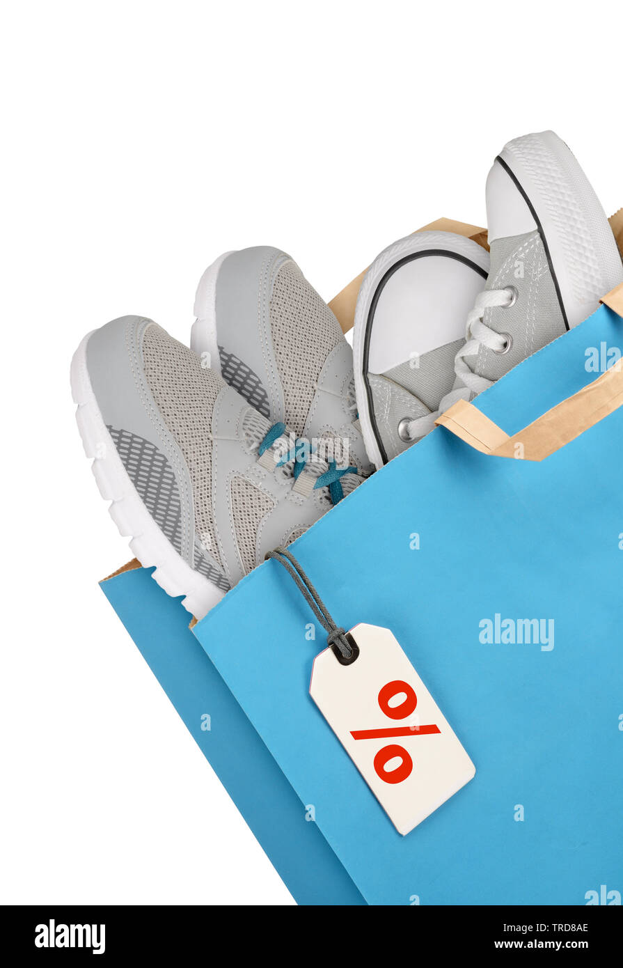 Shopping bag with sport shoes isolated on white background Stock Photo