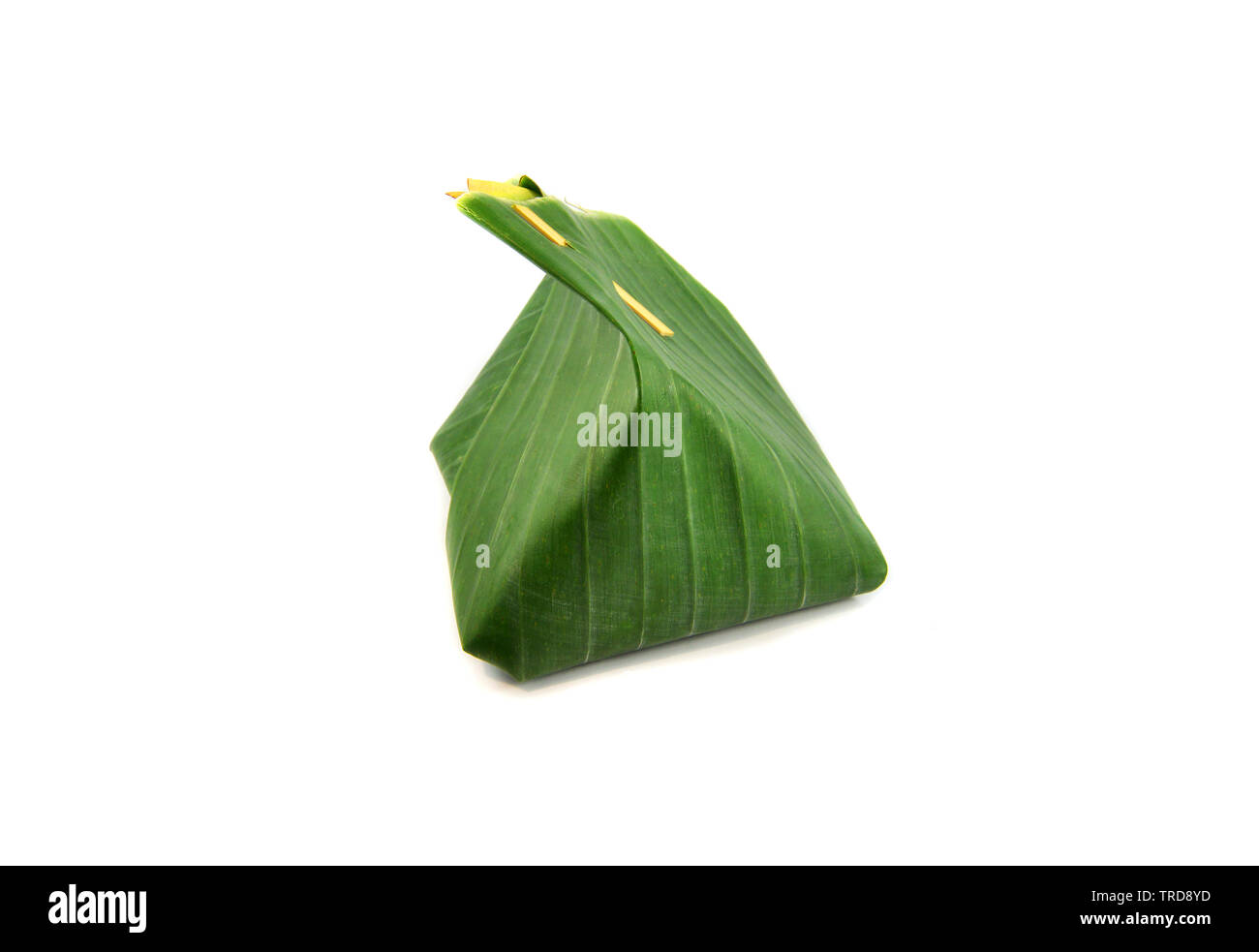 Banana leaf wrap dessert and thai food packaging from natural Stock