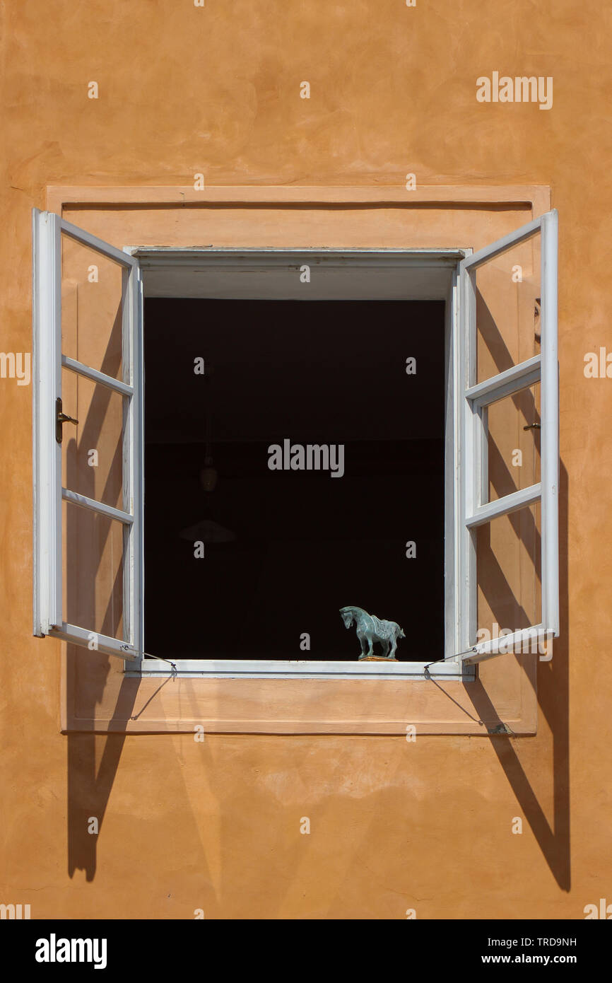 Horse sculpture on a window sill Stock Photo