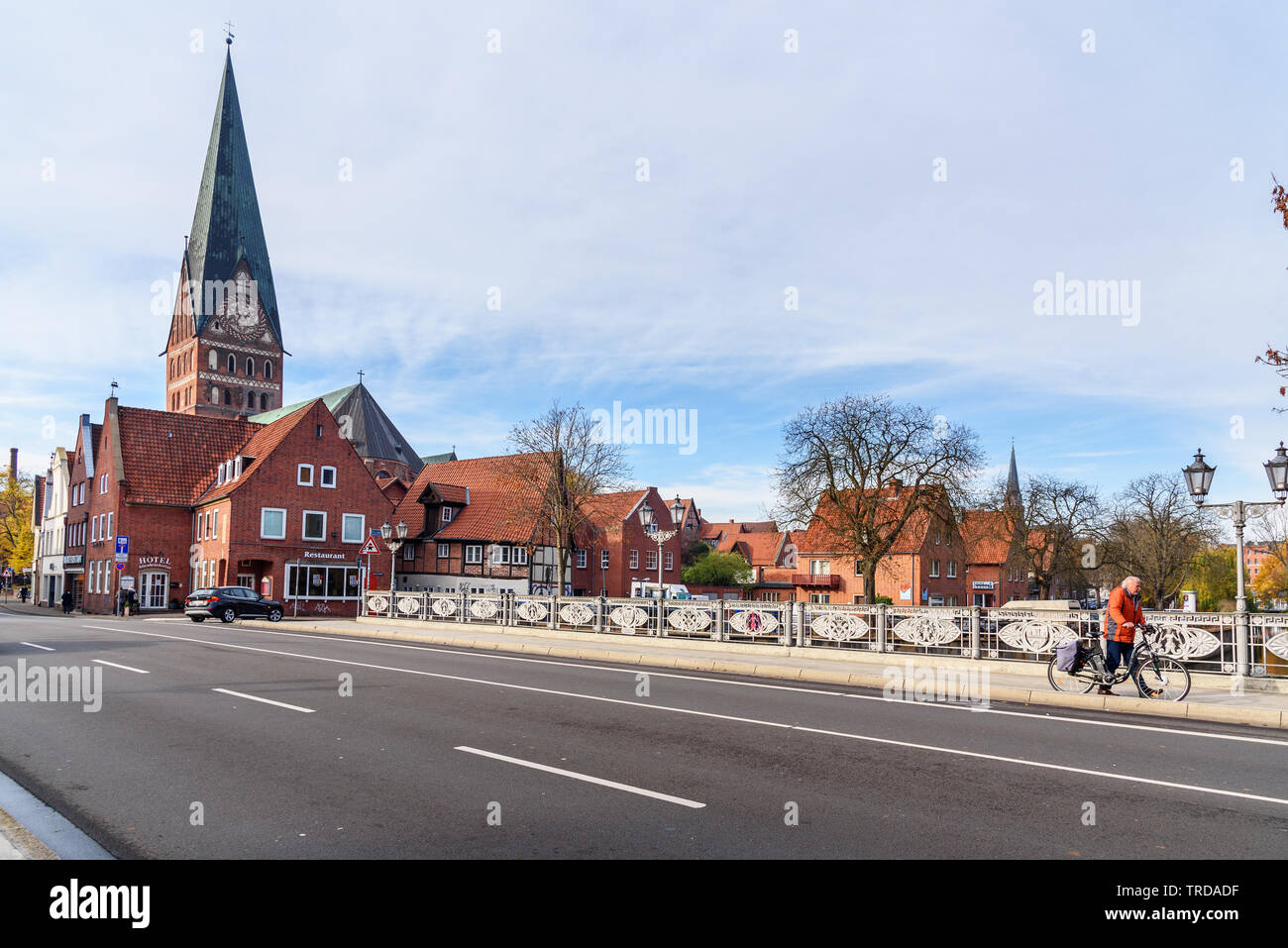 Luneburg, Germany - November 06, 2018: View of Cathedral and old historical houses from bridge over Ilmenau river in Luneburg Stock Photo
