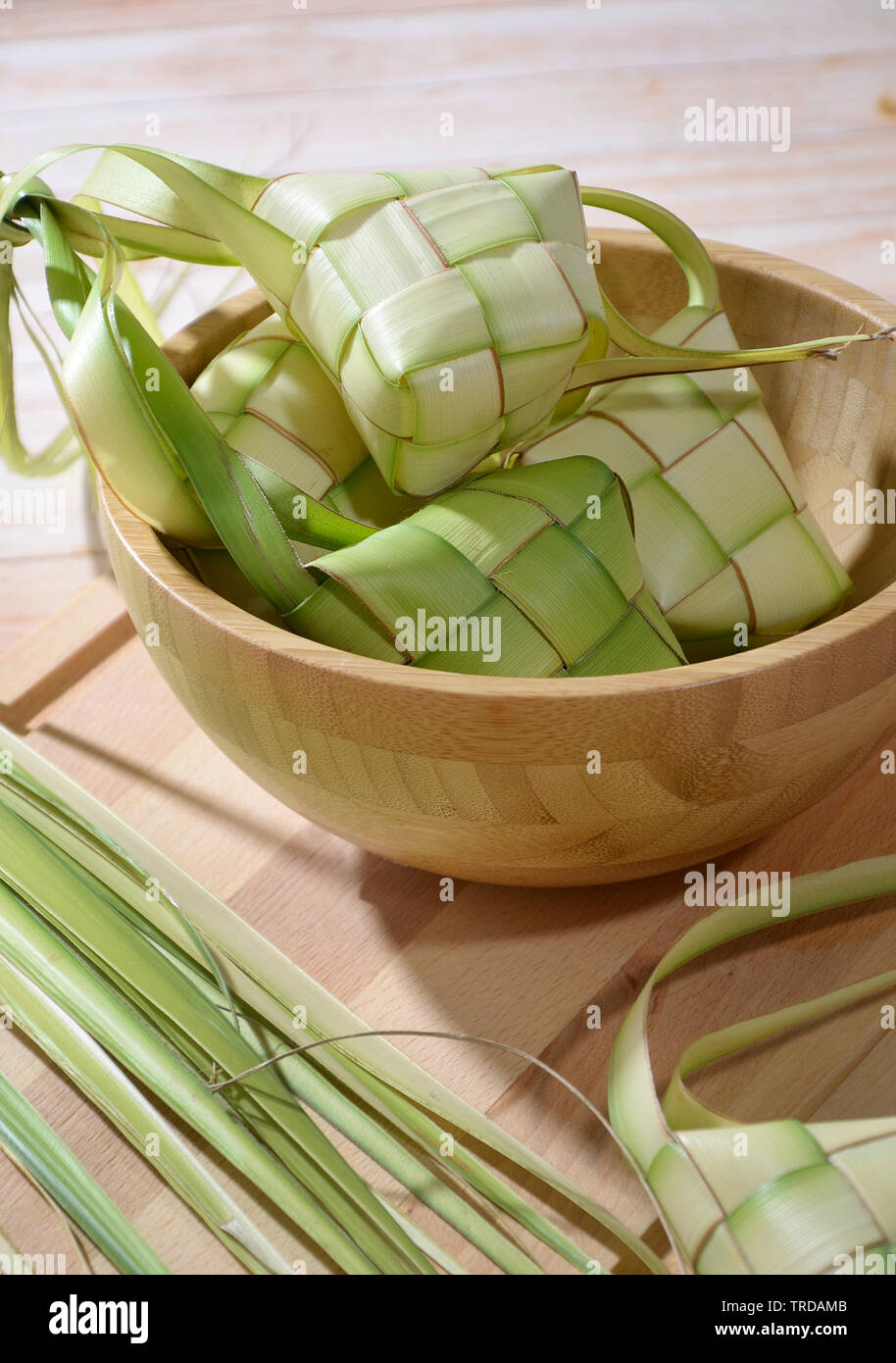 Ketupat, Rice Cake in Diamond Shape Pouch Made from Woven Coconut Leaves Stock Photo