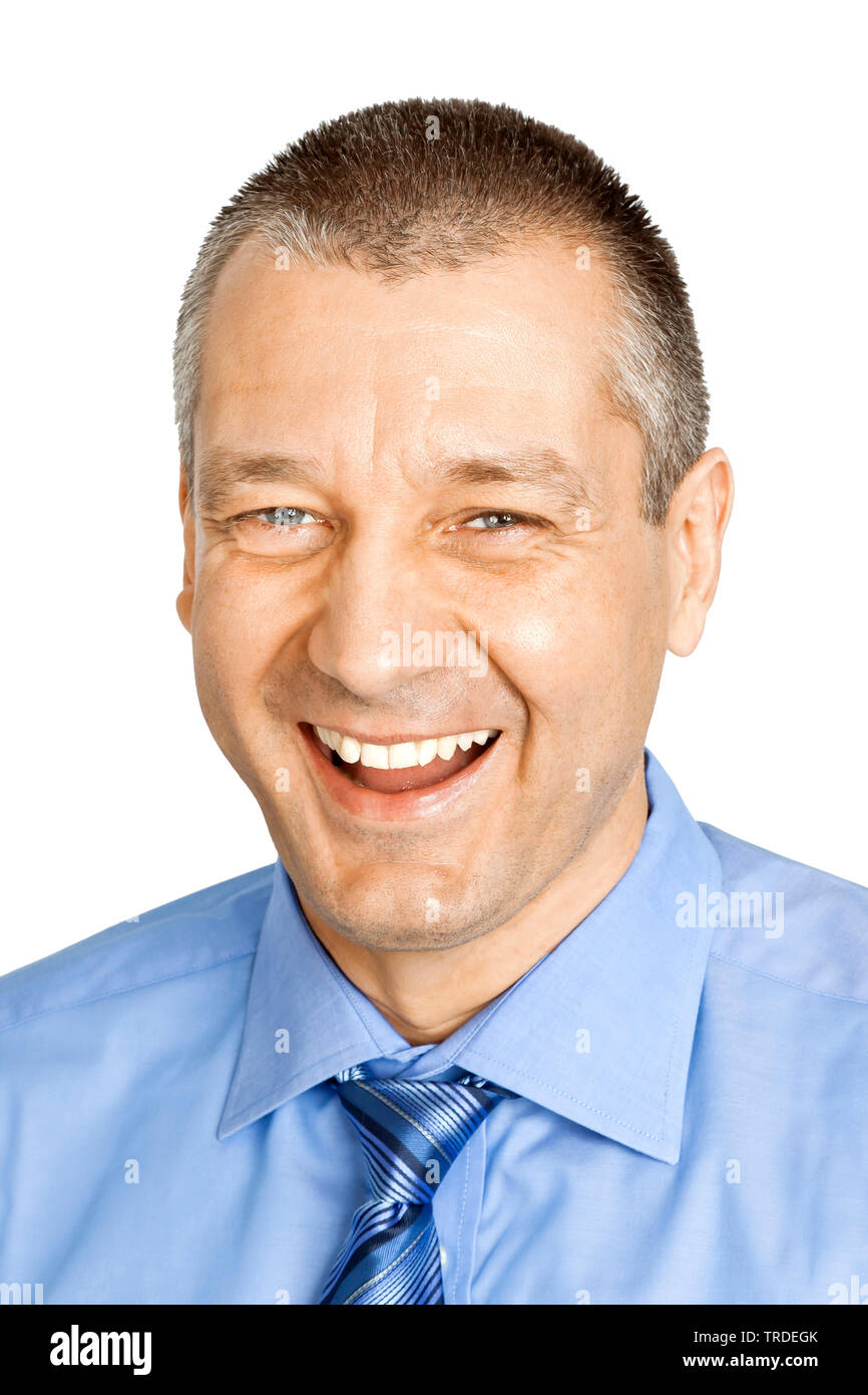 Head / shoulder portrait of a laughing Businessman dressed in a blue shirt and tie Stock Photo