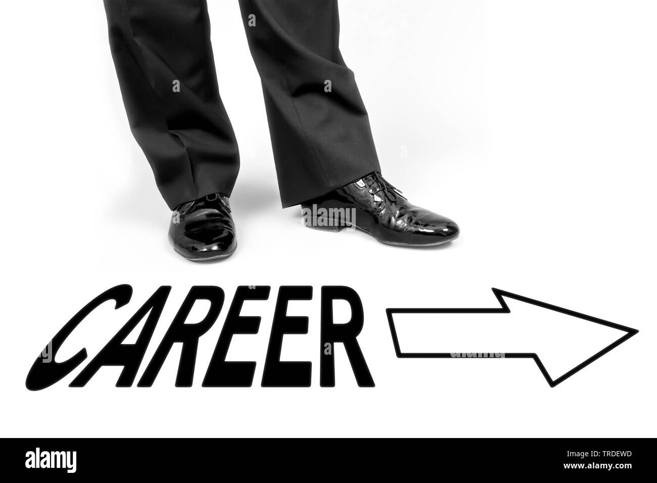 Close-up view of legs of a male dressed in a black suit with the lettering CAREER on the floor Stock Photo