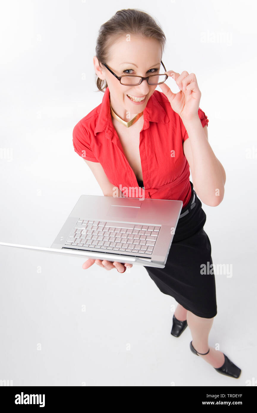 Portrait of a young likeable Business woman holding a laptop and smiling into the camera Stock Photo