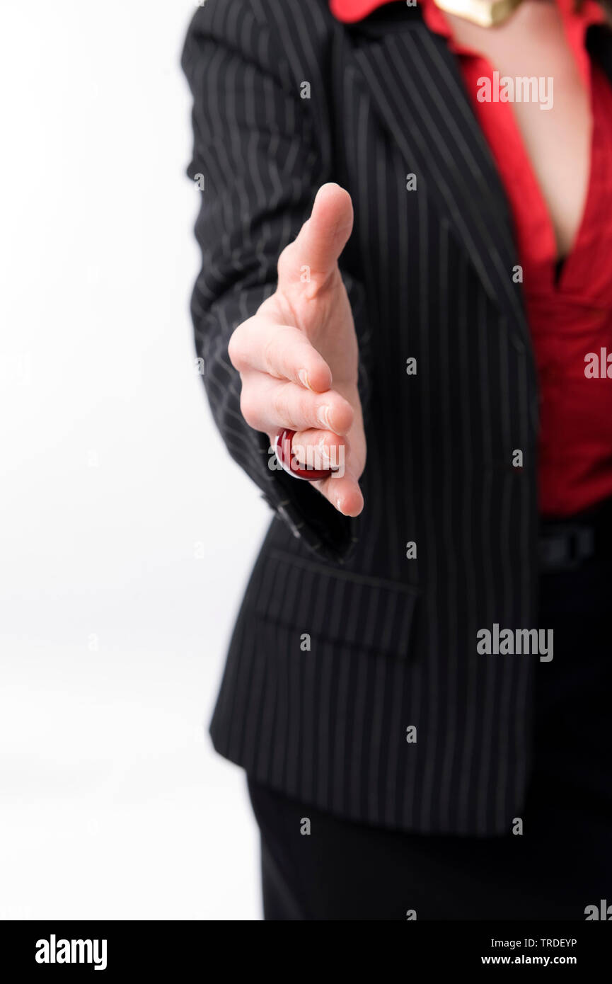 Close up of a young Business woman in a black suit with outstreched hand Stock Photo